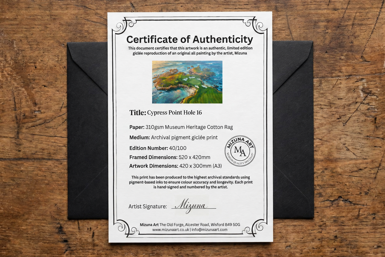 Cypress Point Hole 16 certificate of authenticity laid over its black presentation envelope