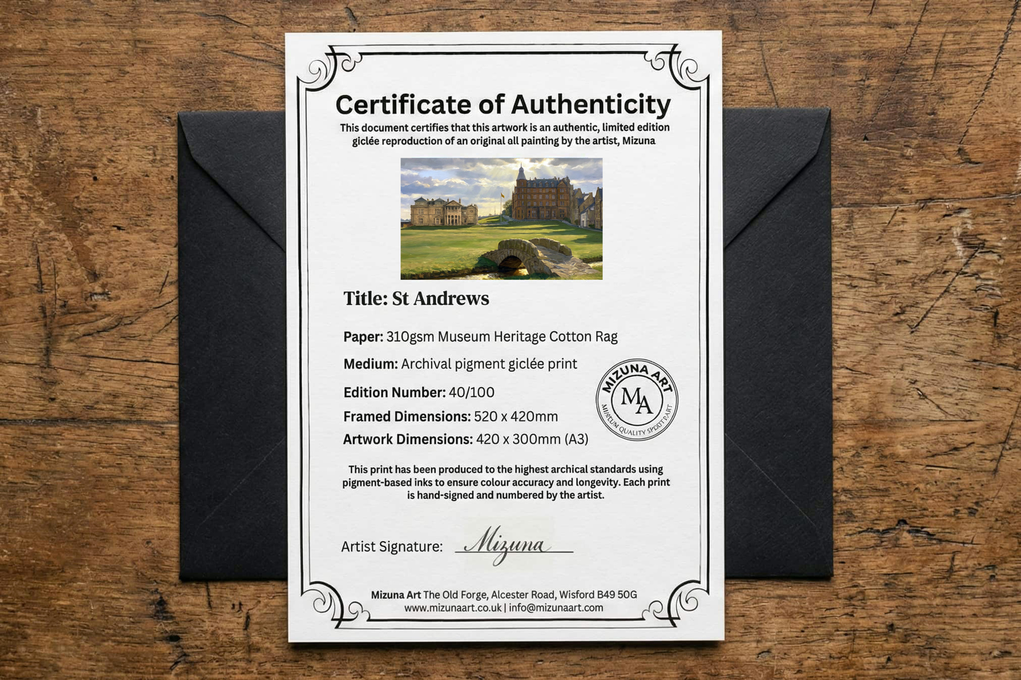 A St Andrews certificate of authenticity in front of its black presentation envelope